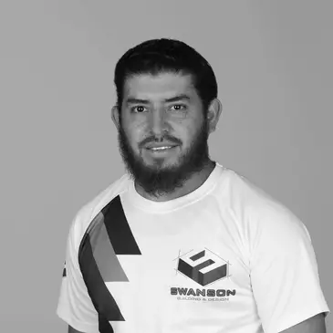 Man in logo t-shirt, smiling