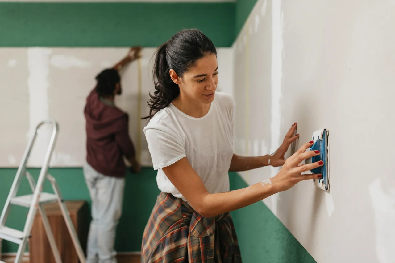 Couple renovating a room together