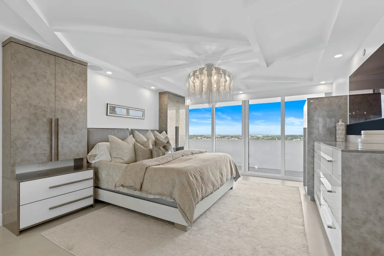Elegant bedroom featuring chandelier