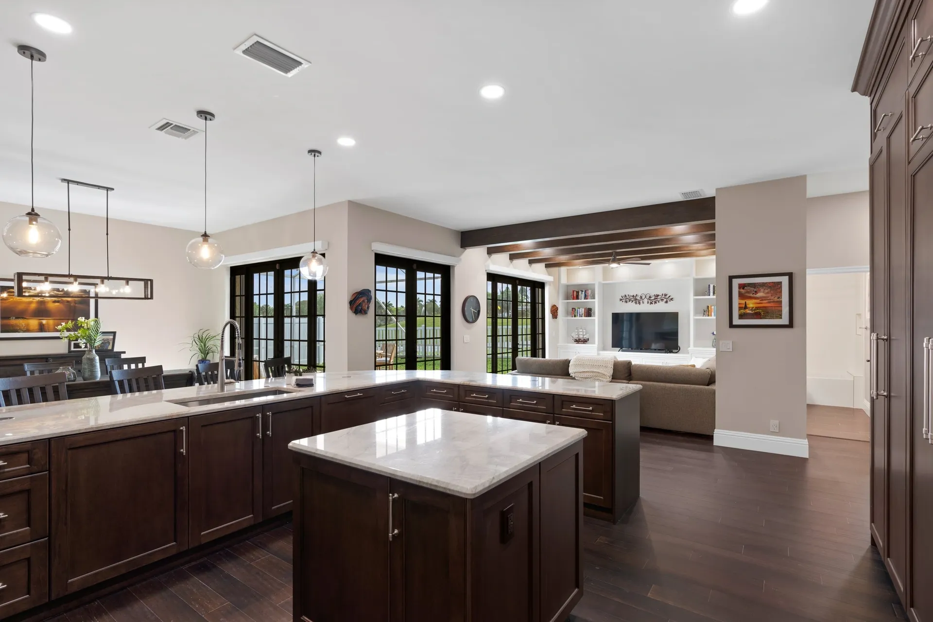 Contemporary kitchen with island and pendant lights