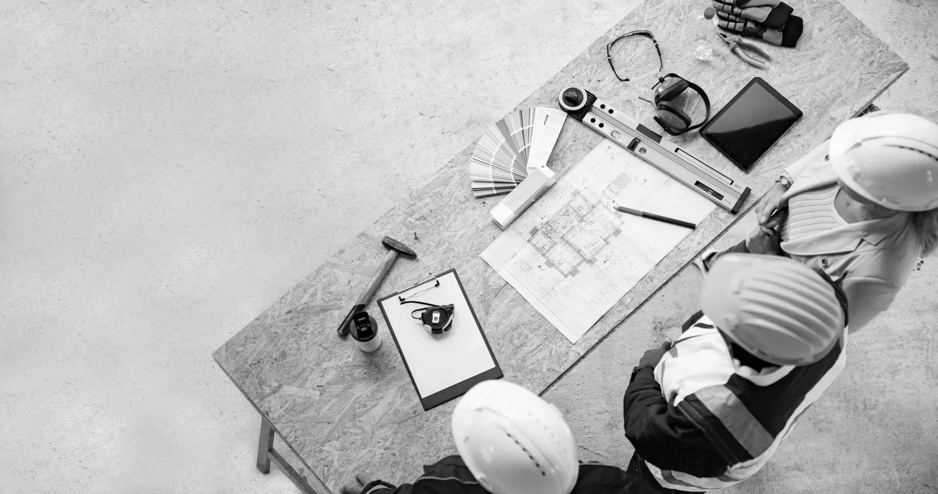 Construction team examining building designs