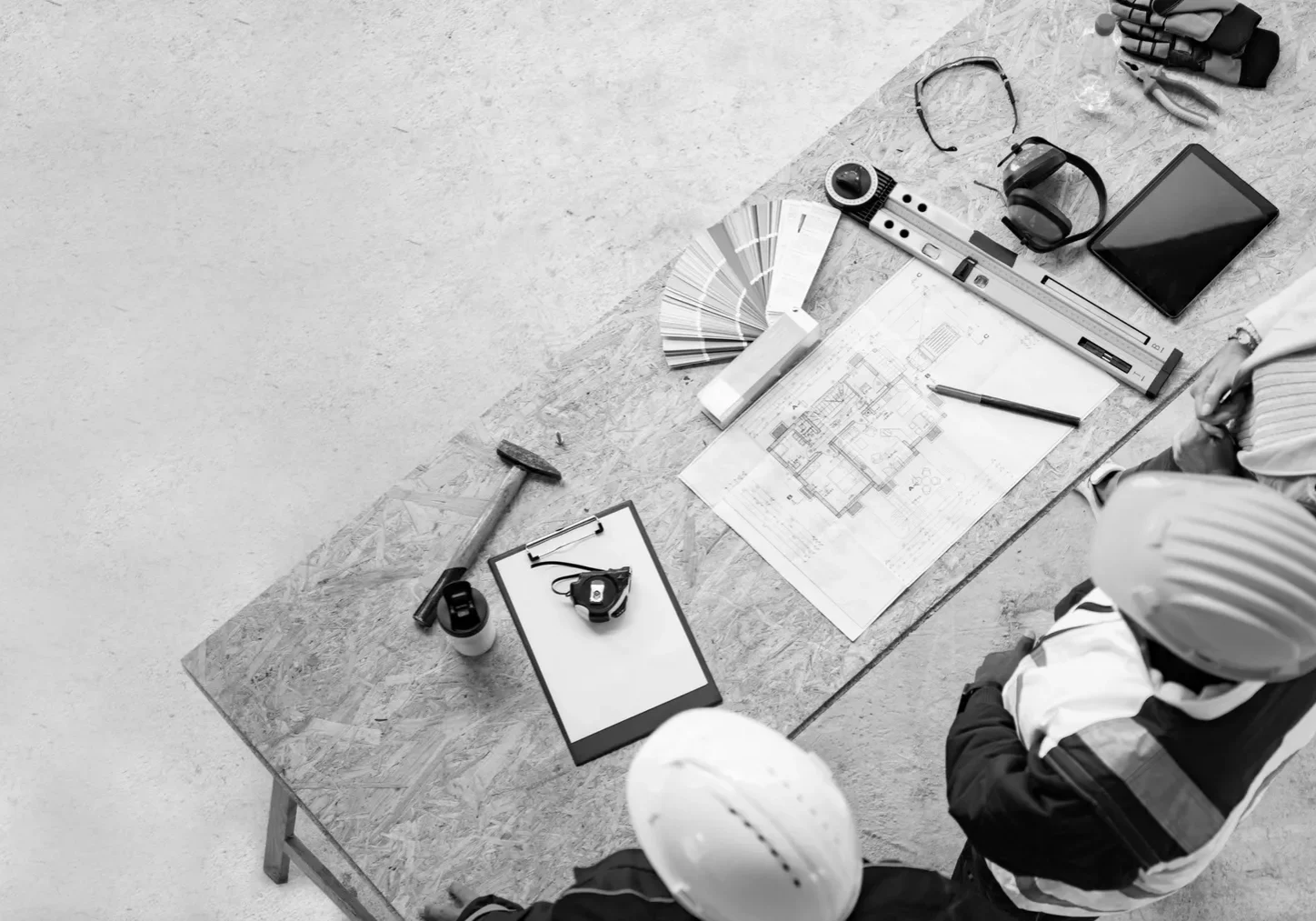 Construction team examining building designs
